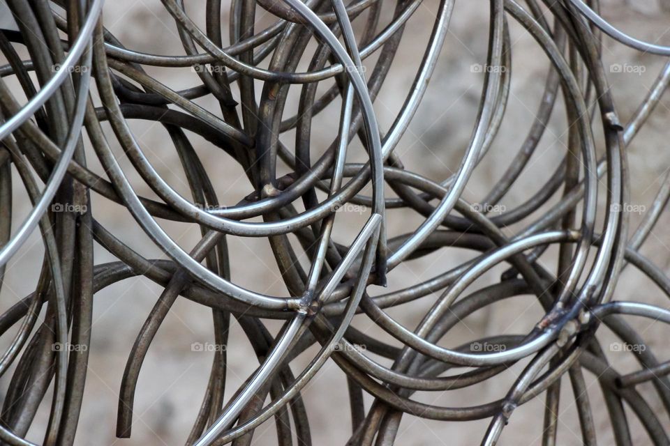 Intertwined curved metal wires