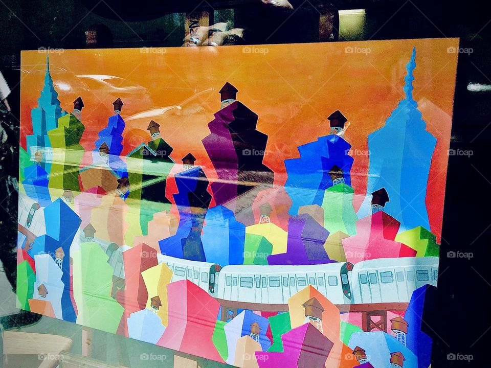 A colorful modern art display can be seen through this shop window in “Clinton Hill”. Brooklyn on a sunny day in 2021. Hypnotic Productions