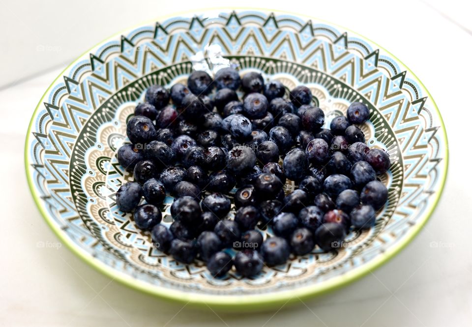 Fresh,organic blueberries in a decorative bowl
