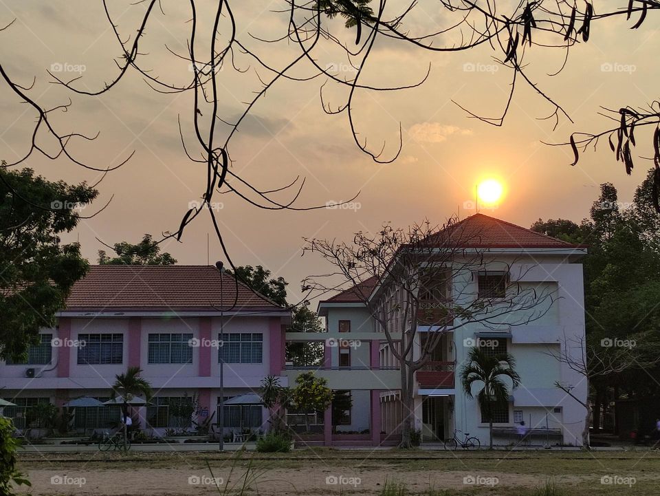 Sunset creates a beautiful picture in a corner of middle school