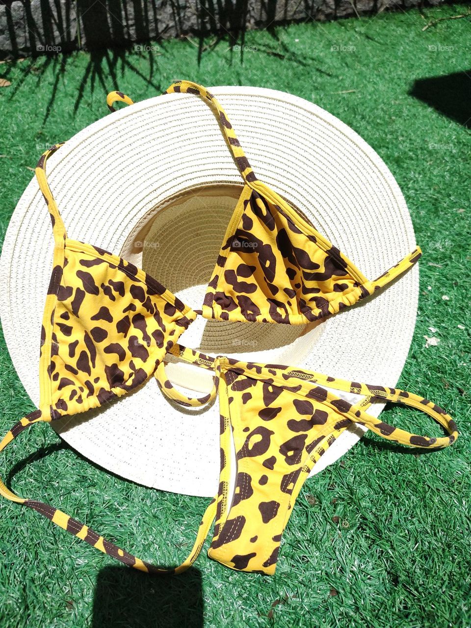 yellow jaguar bikini and hat, to be used in the summer.