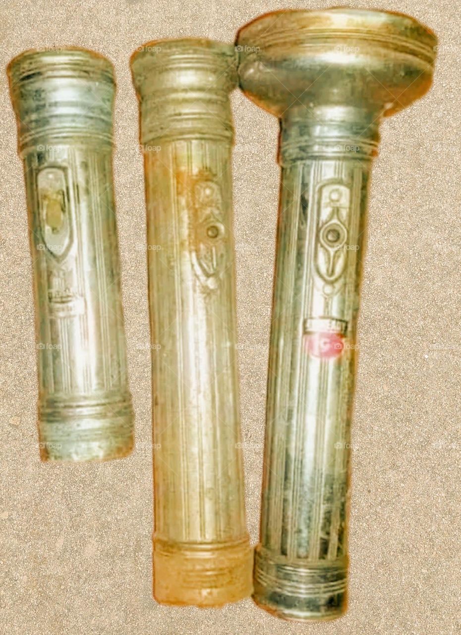 Three torches in very old and dilapidated condition.