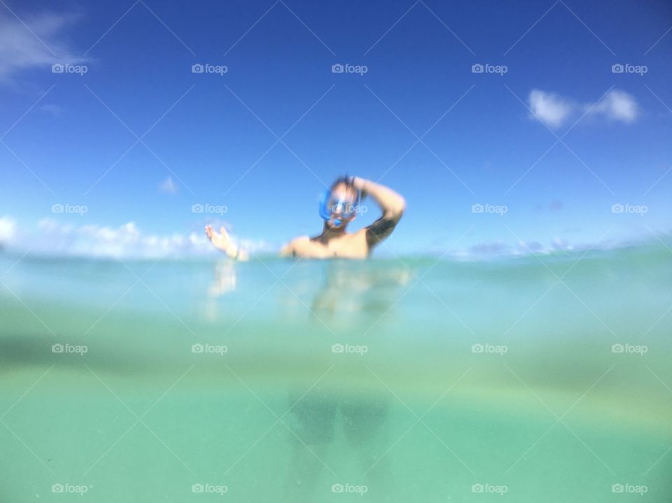 Young man snorkeling and having fun 
