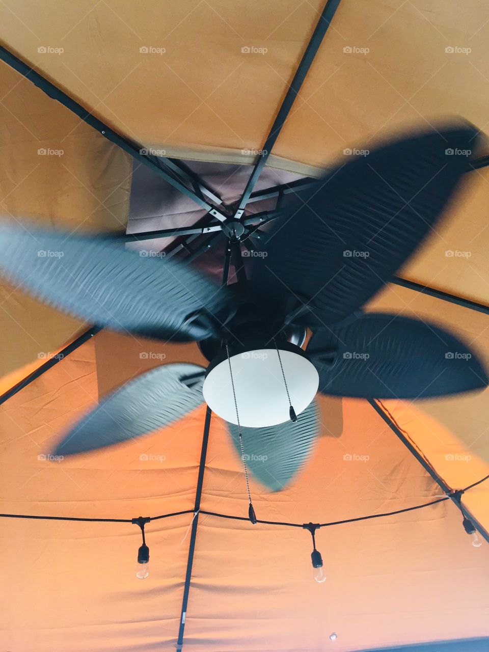 Rotating outdoor ceiling fan
