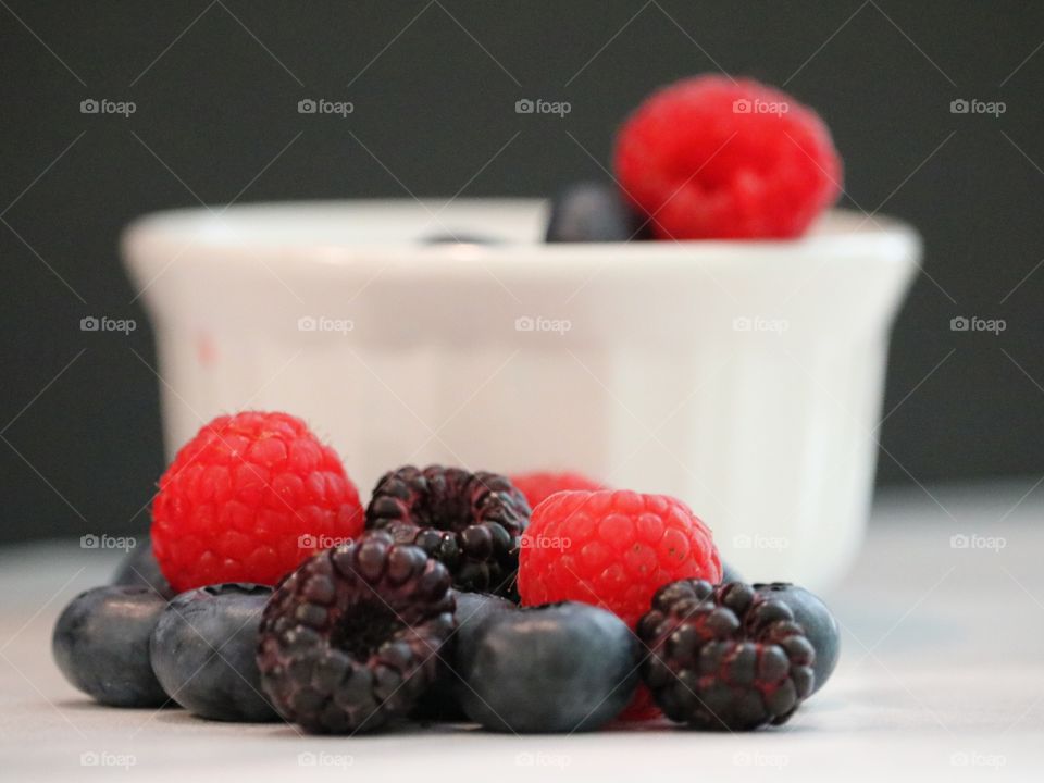 Colorful berries with bowl