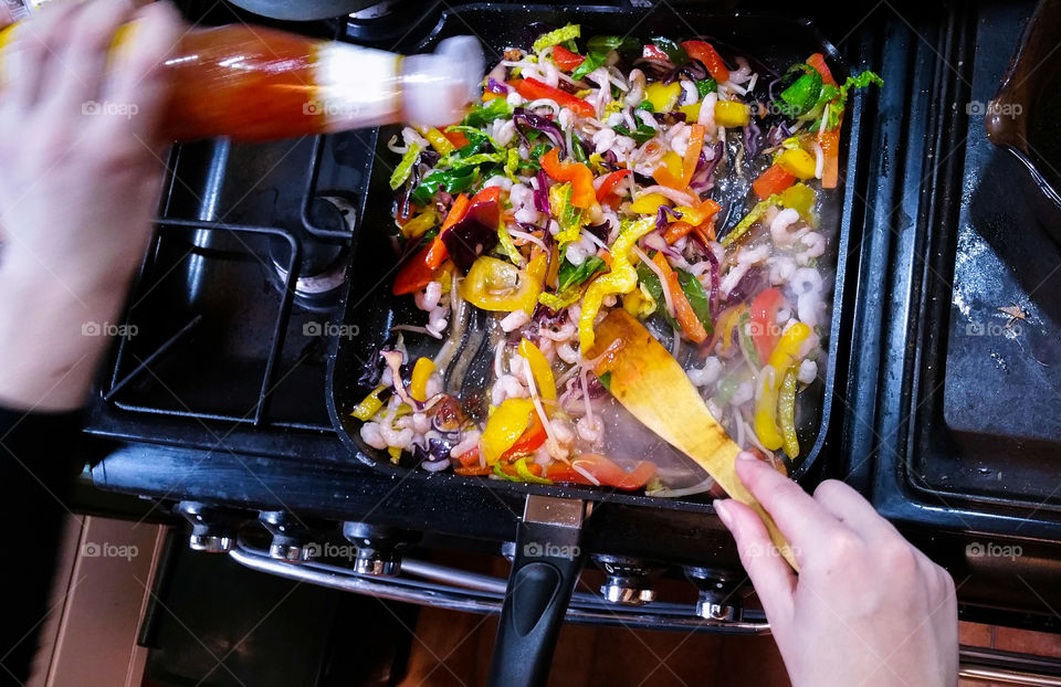 Cooking the prawn and vegetable stir fry with sweet chilli sauce
