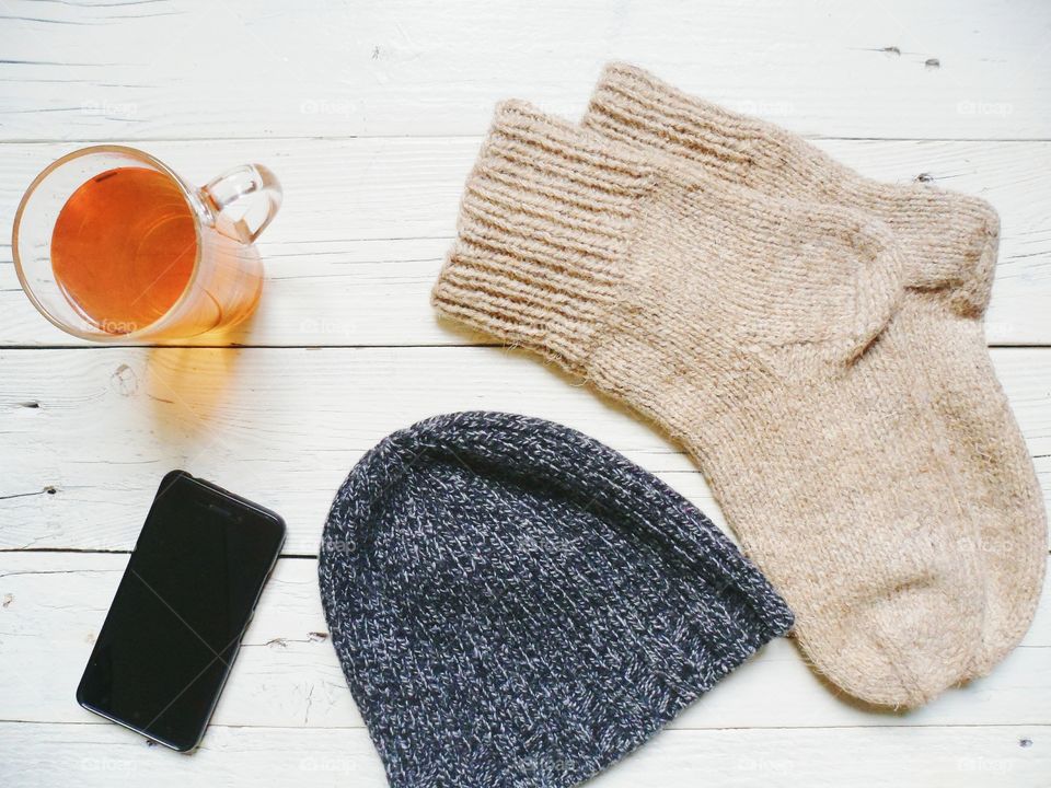 cup of hot tea, socks and a hat will warm in the cold