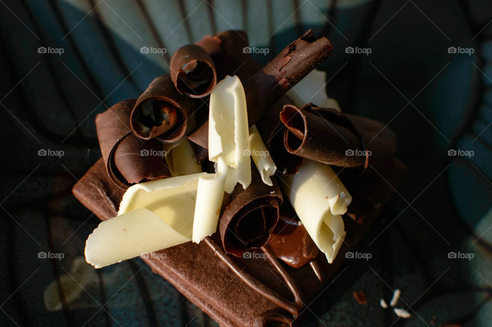 Chocolate shavings on dark cocoa cookie