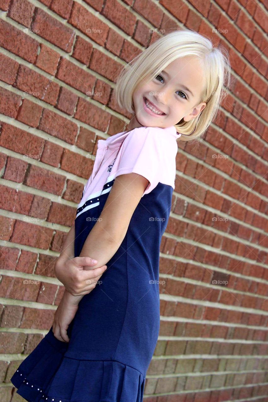 New haircut. Showing off. Sweet. innocent.