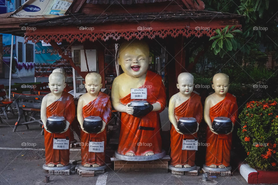 Funny monk donation boxes at a temple in Chiang Mai, Thailand 