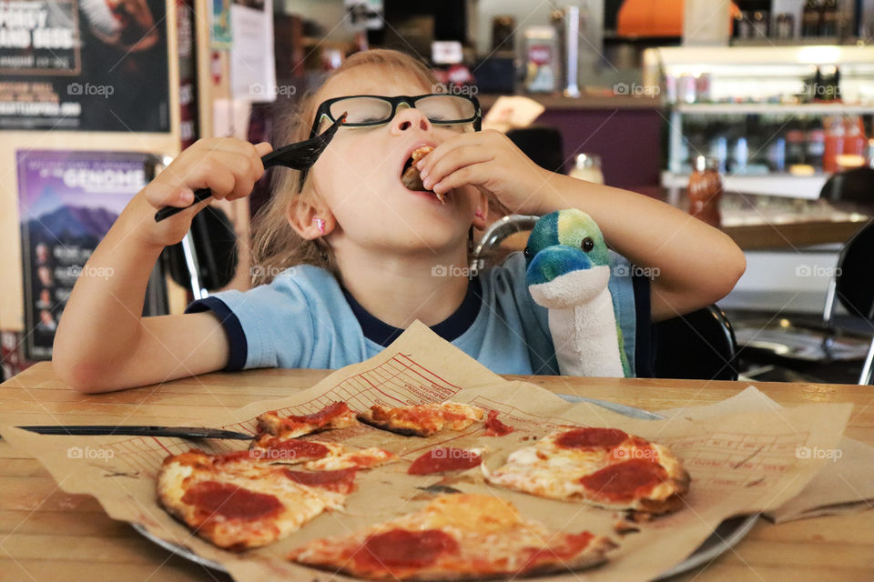 Child eating pizza