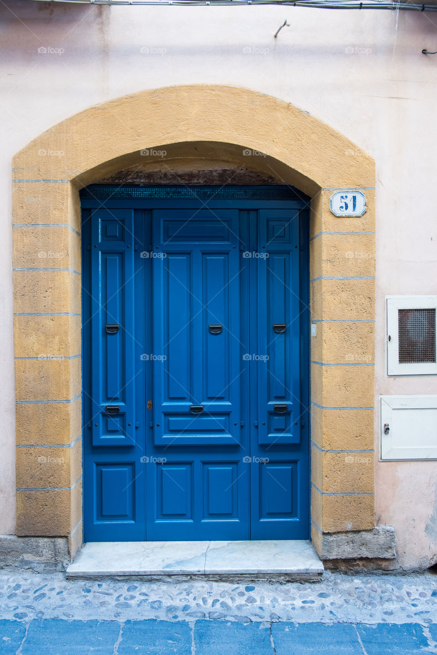 Old door in the city of Cefalu on Sicily.