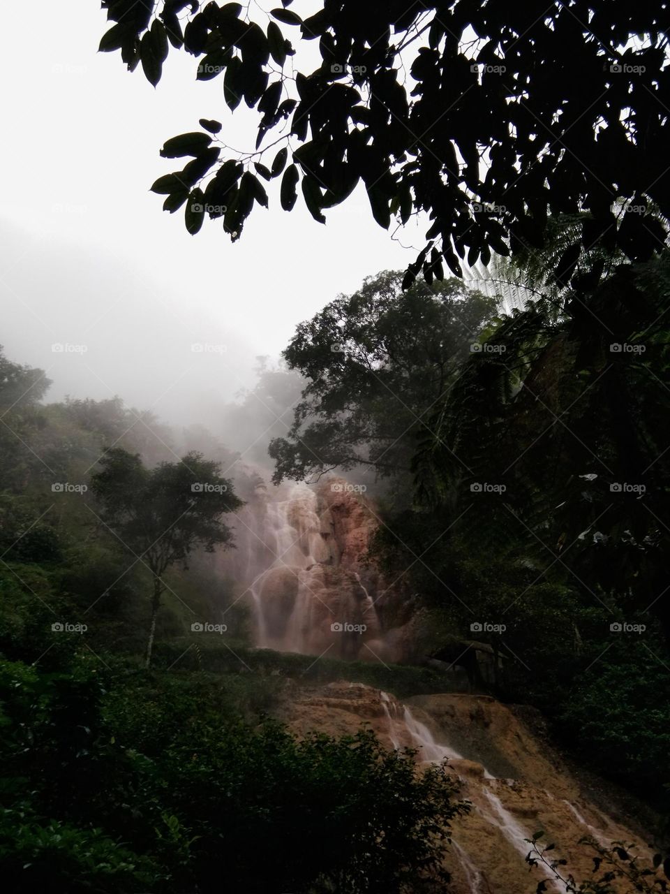 waterfall of hot springs at the mountain