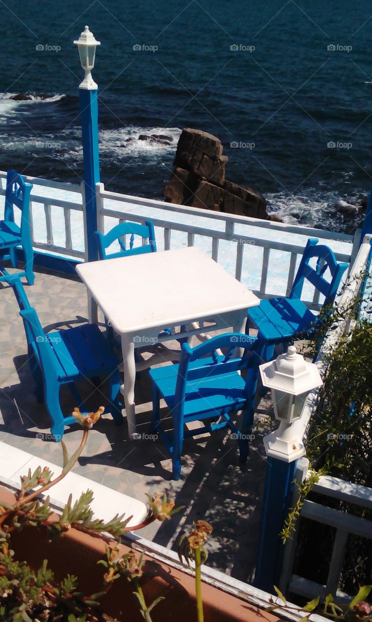 The blue chairs and sea