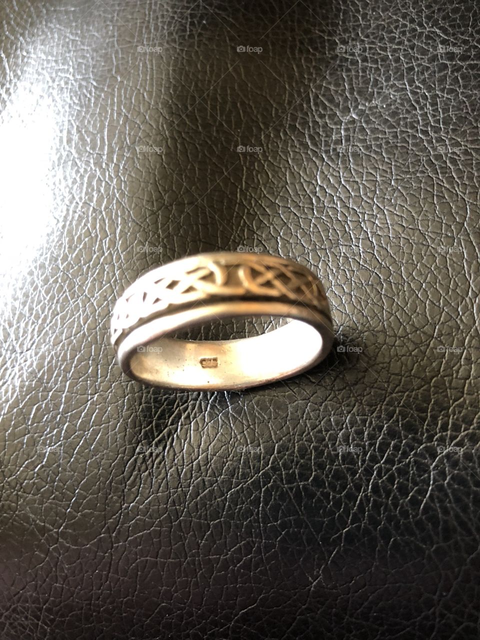A silver spinner ring