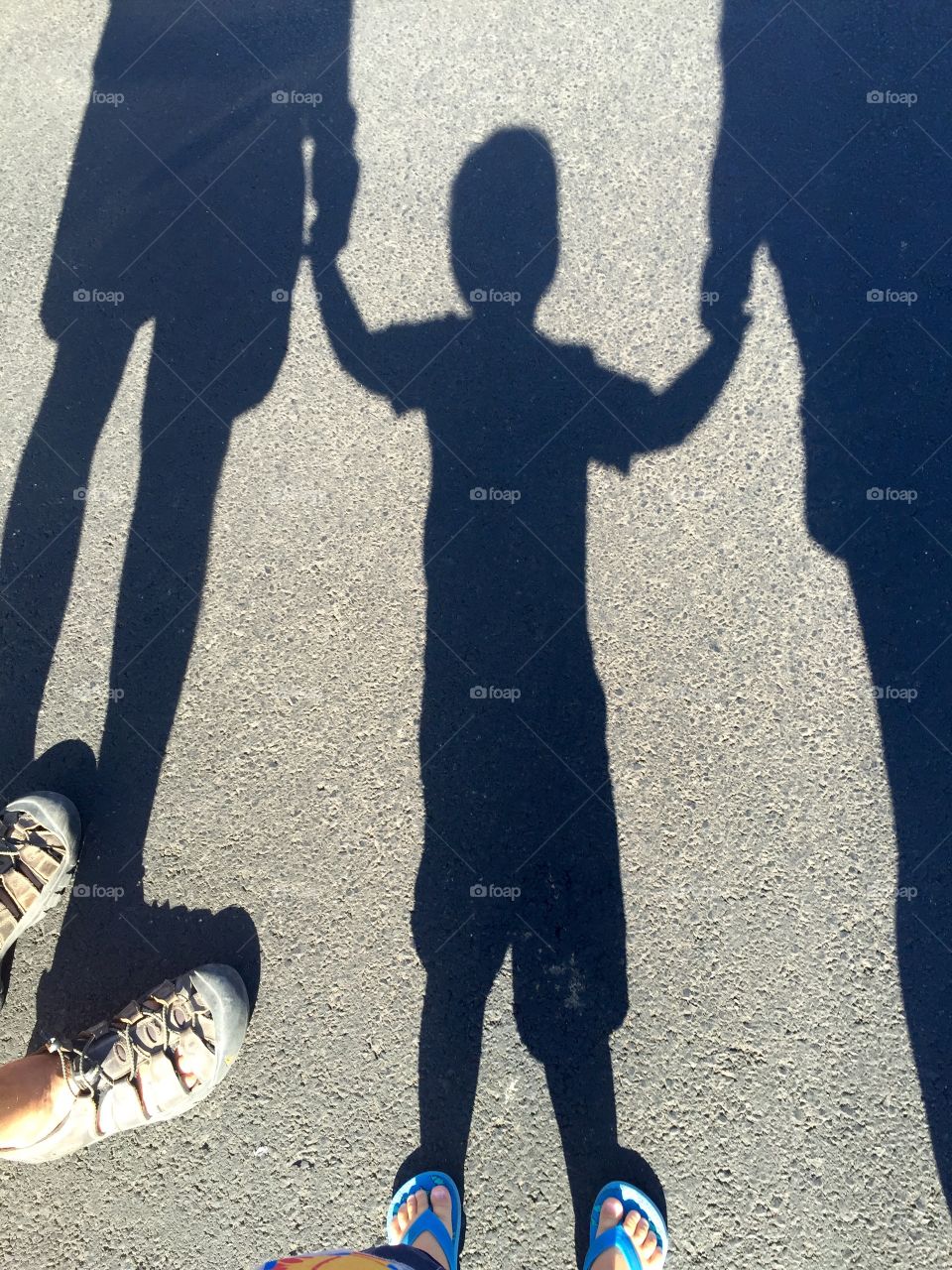 This is a shadow photo of my husband, my grandson, and myself as we took a walk