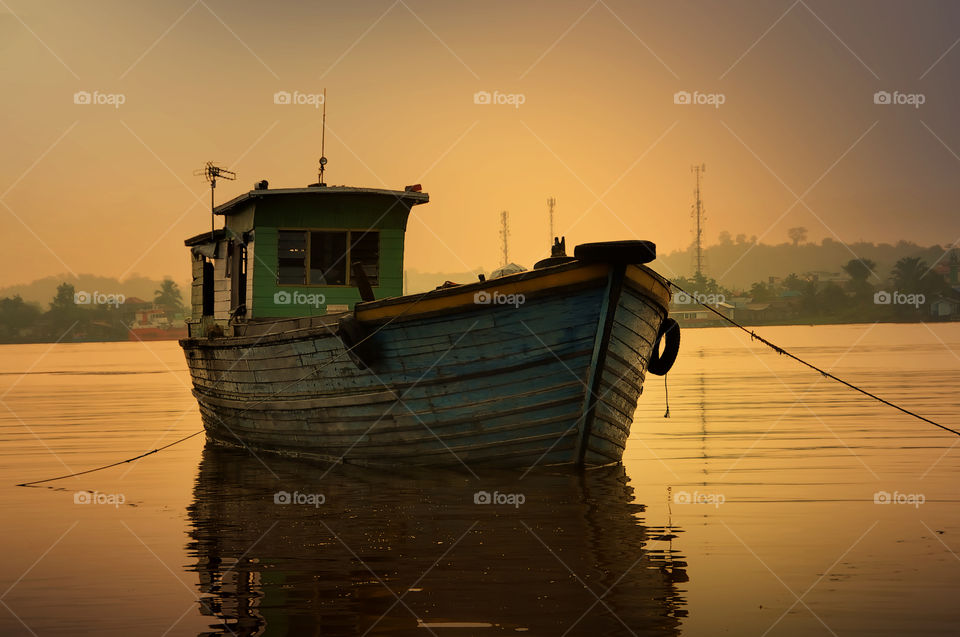 a boat at mahakam river when sunset