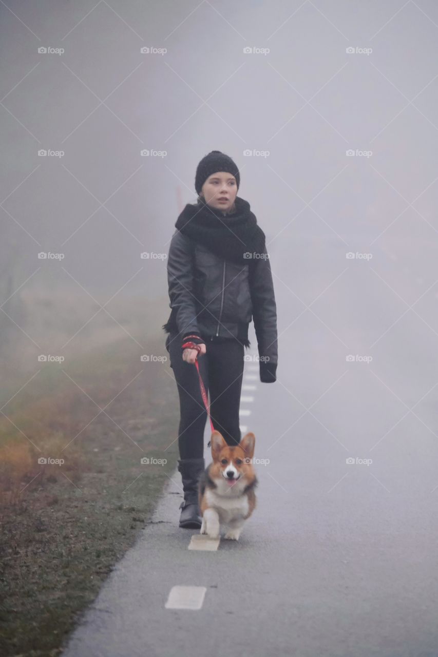 Girl walking with the dog