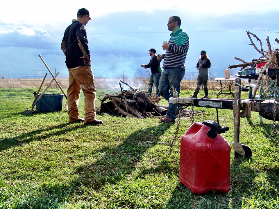 Spring Bonfire Prep. Preparing for a springtime bonfire at the farm.