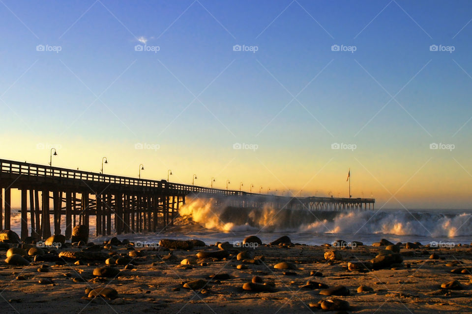 Ventura Pier Sturm Sunset
 
Ocean waves throughout at storm crashing into the Ventura pier.