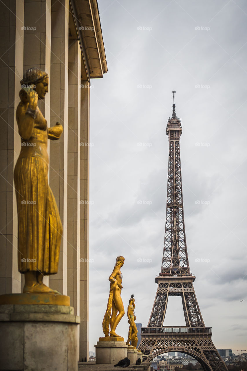 The Eiffel Tower from the place of the Trocadero under a cloudy sky in Paris 
