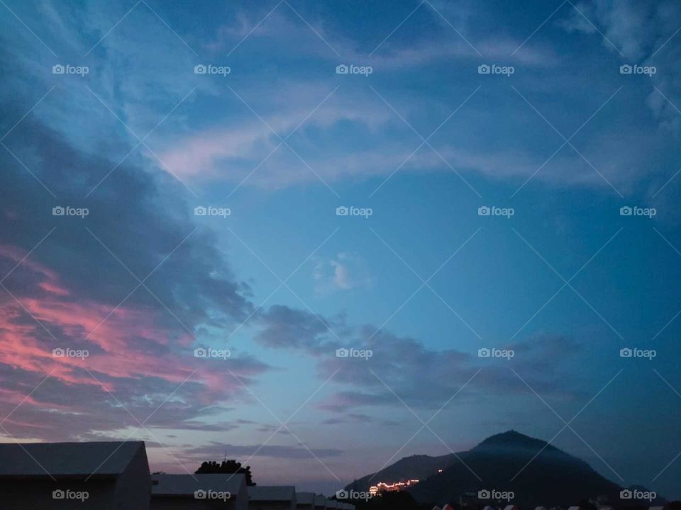 Sometimes a mountain seems to be smaller in front of cloud