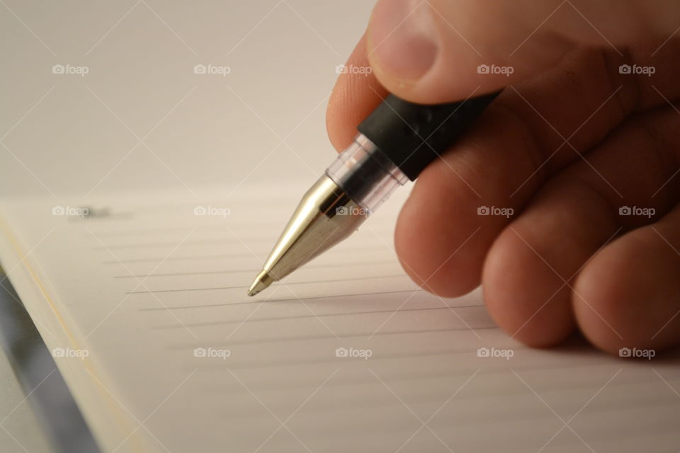 writing on a notebook