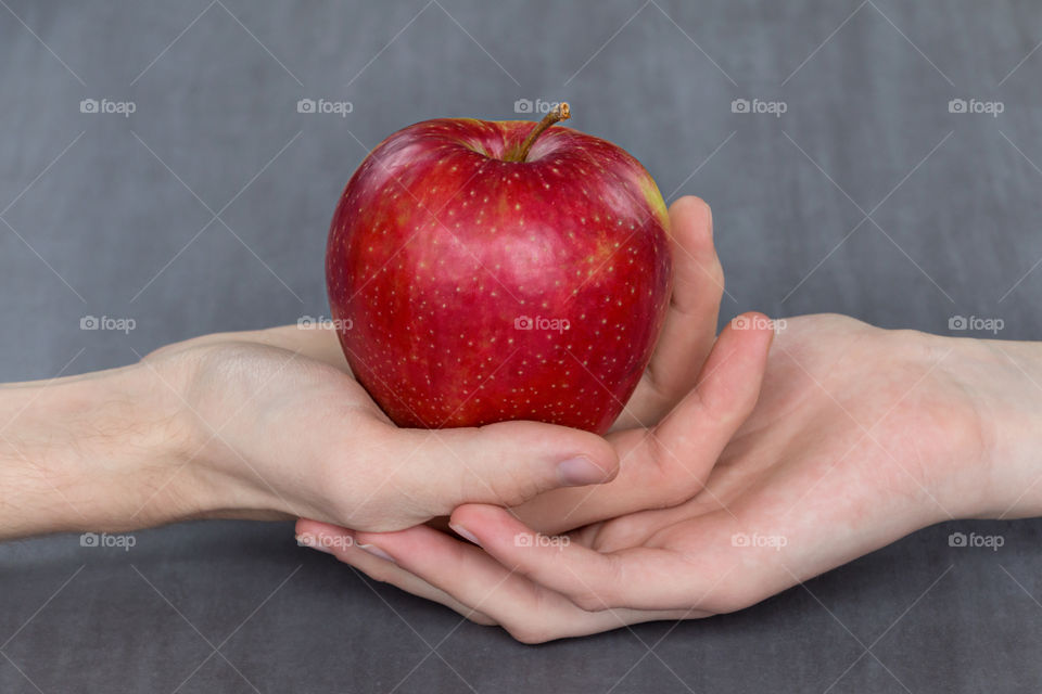 red Apple in hands