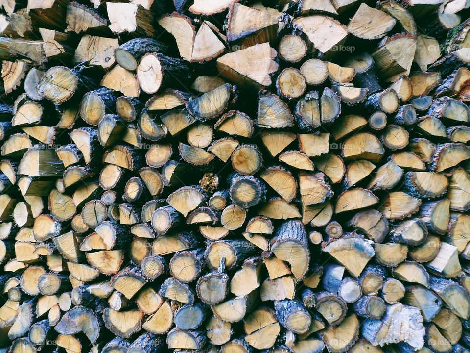 The texture of the stacked firewood