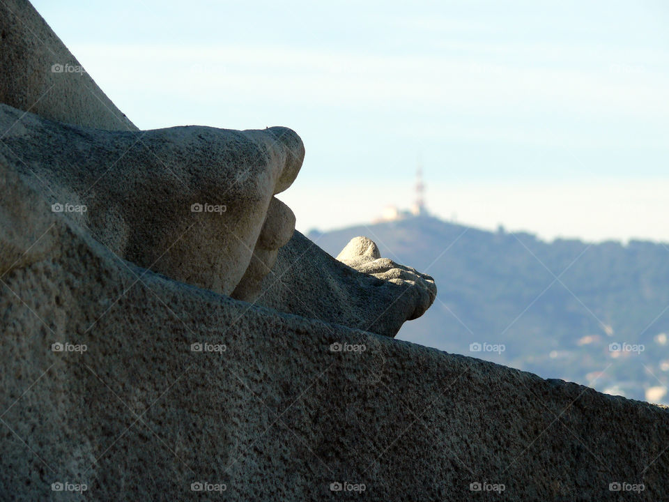 Close-up of sculpture detail against sky in Barcelona, Spain.