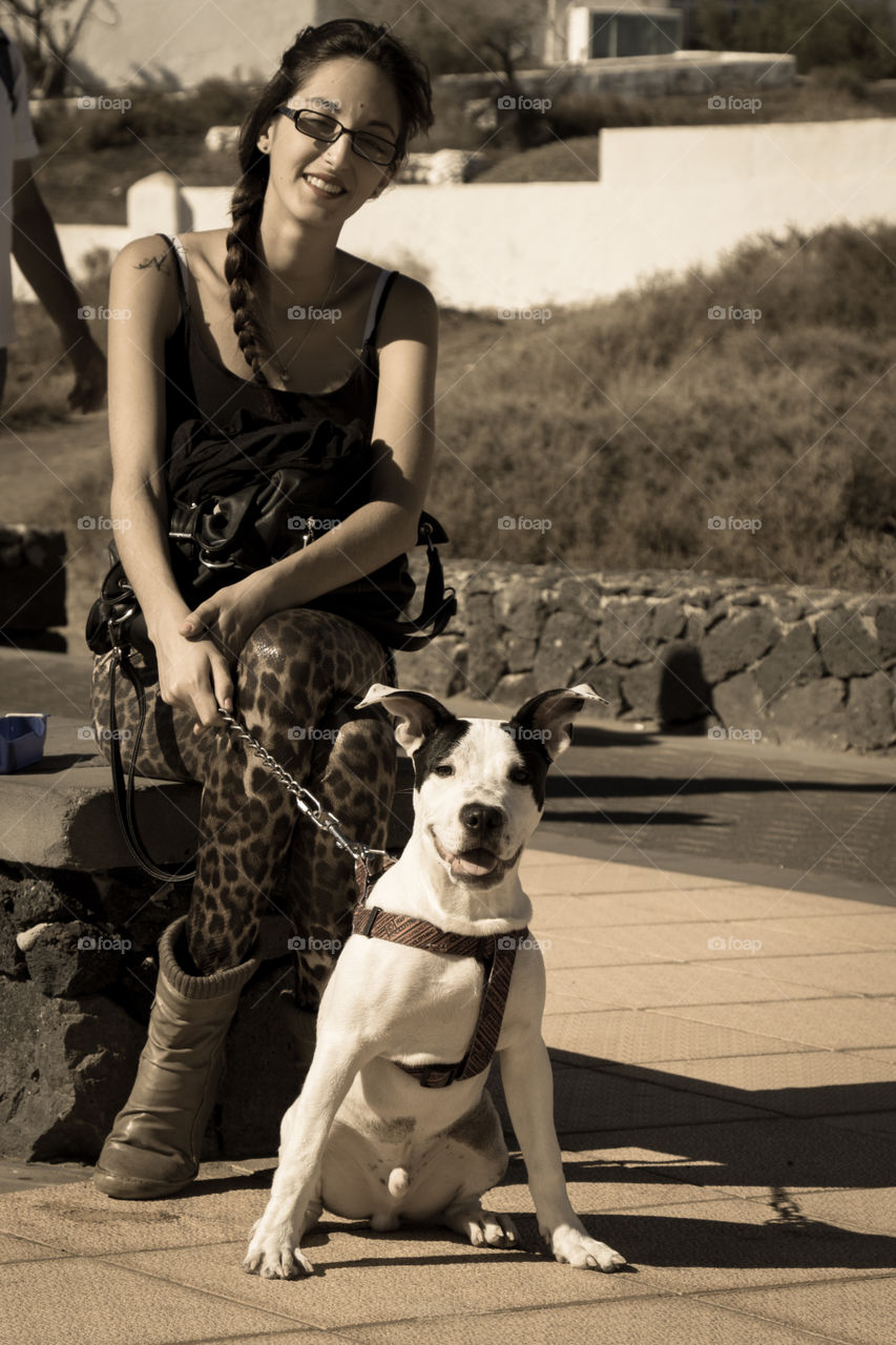 Girl sitting with dog