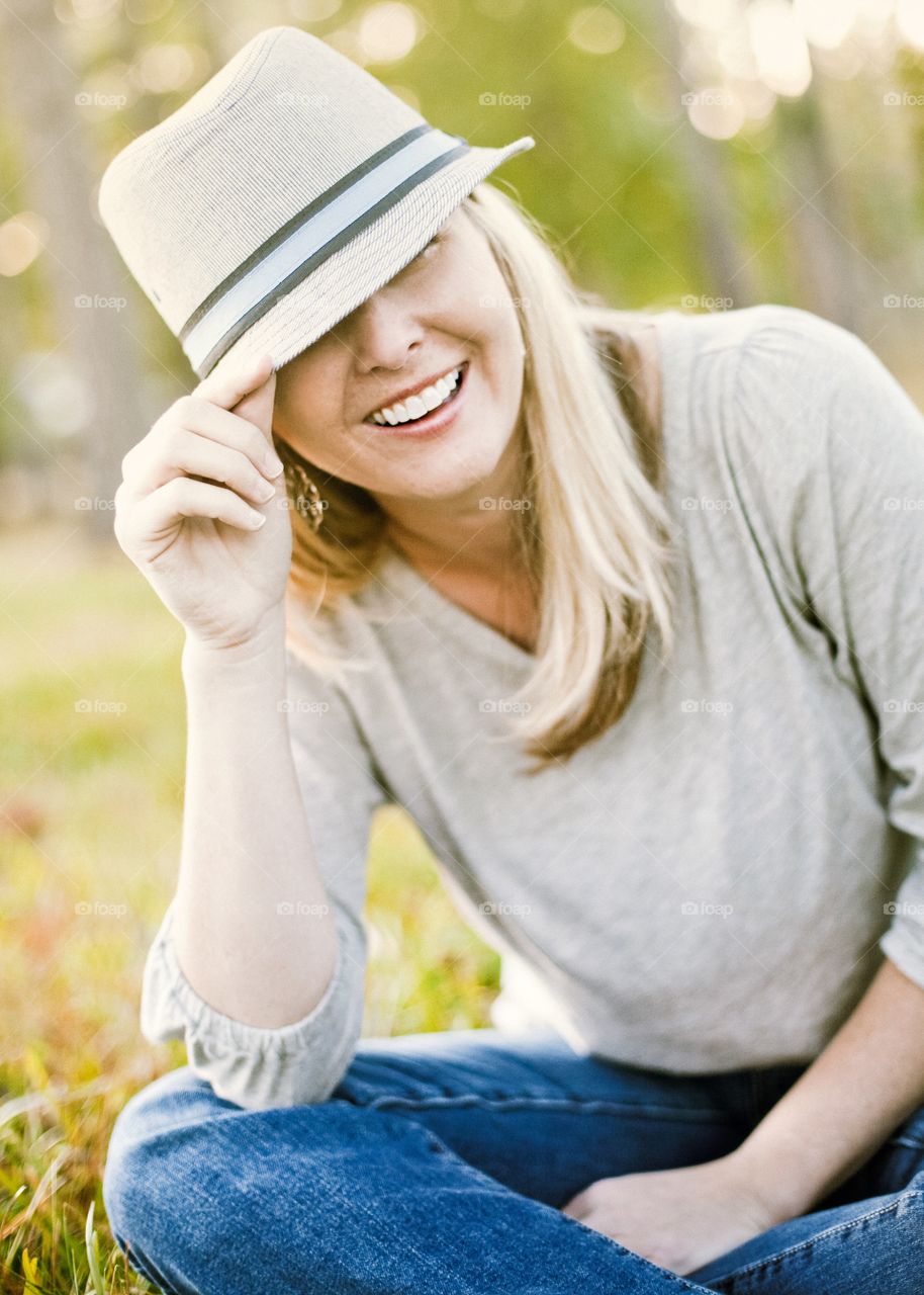 Beautiful woman in hat smiling 