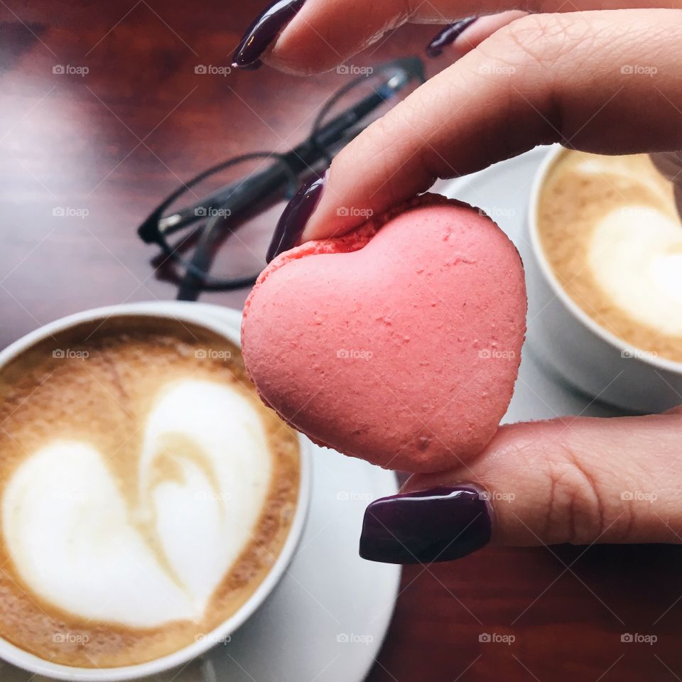 Woman hand holding a macaroon