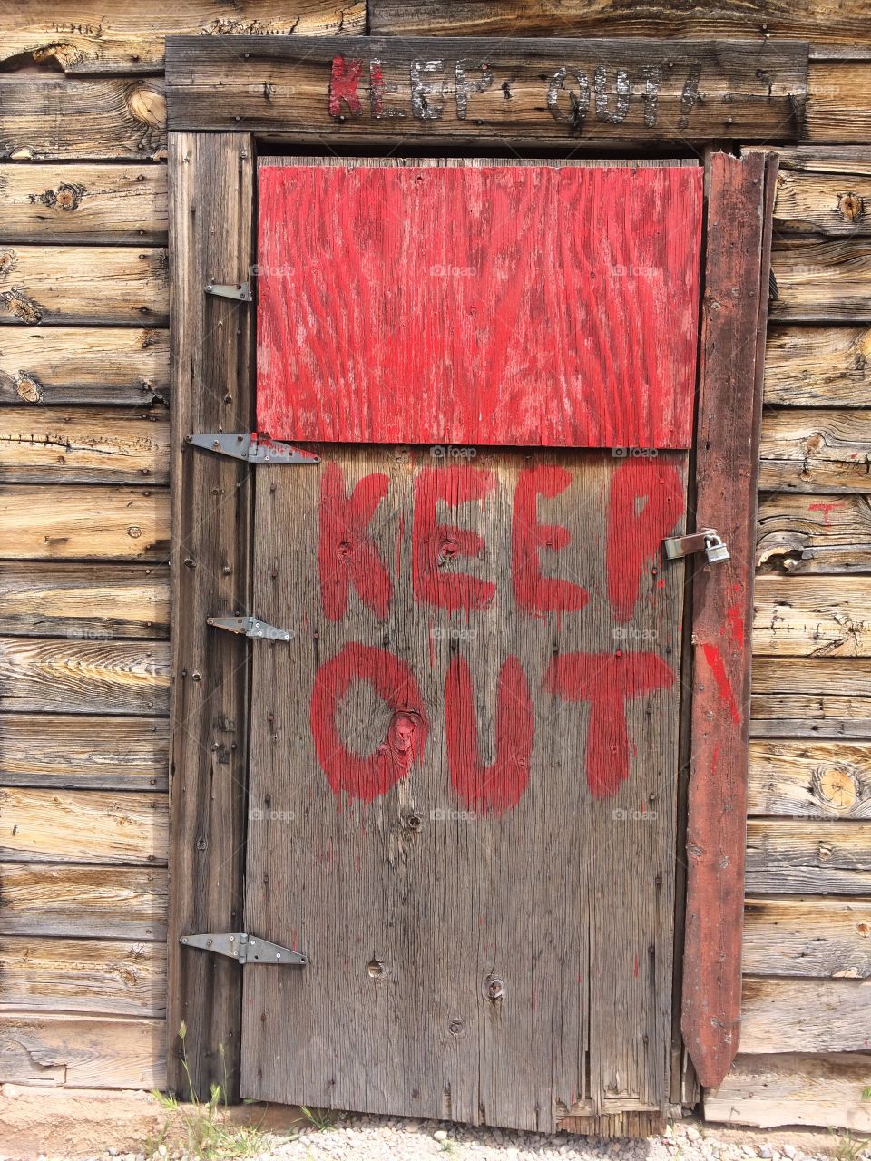 Door with a warning of keep out. 