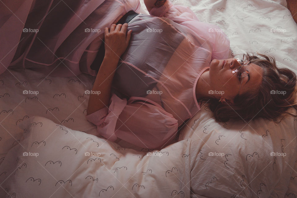 Girl relaxing in bed