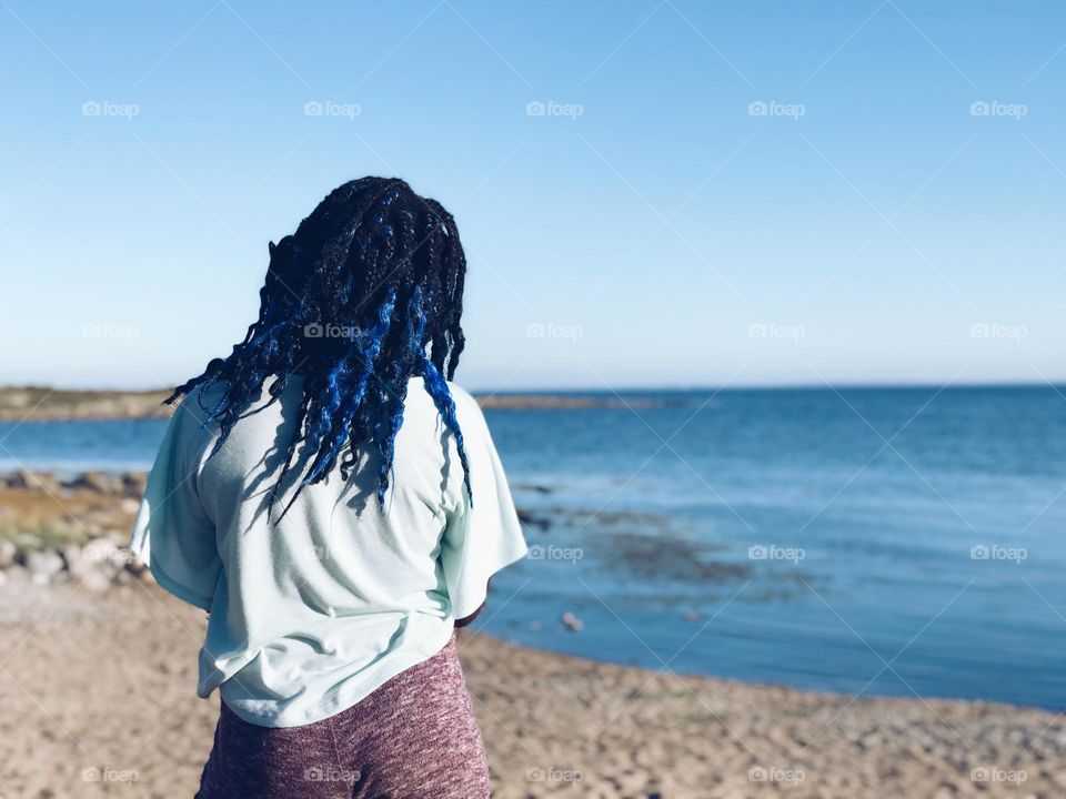 Girl by the beach in blueish hair 