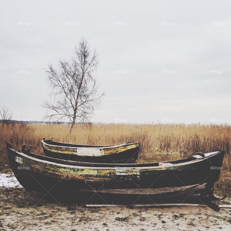 Two boats on wet sand