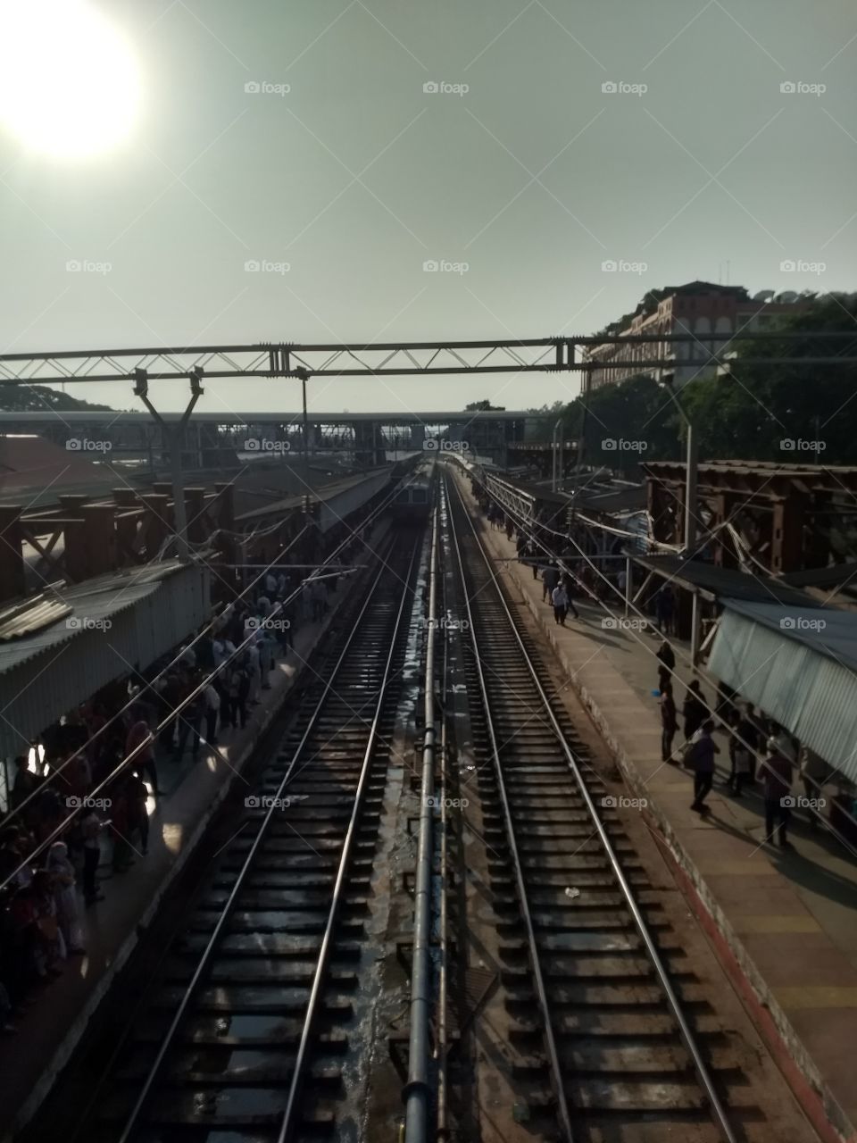 This photo is taken at Pune station by a mobile Moto g5 plus. This is a big crowded place in Pune. The photo was taken from a bridge.