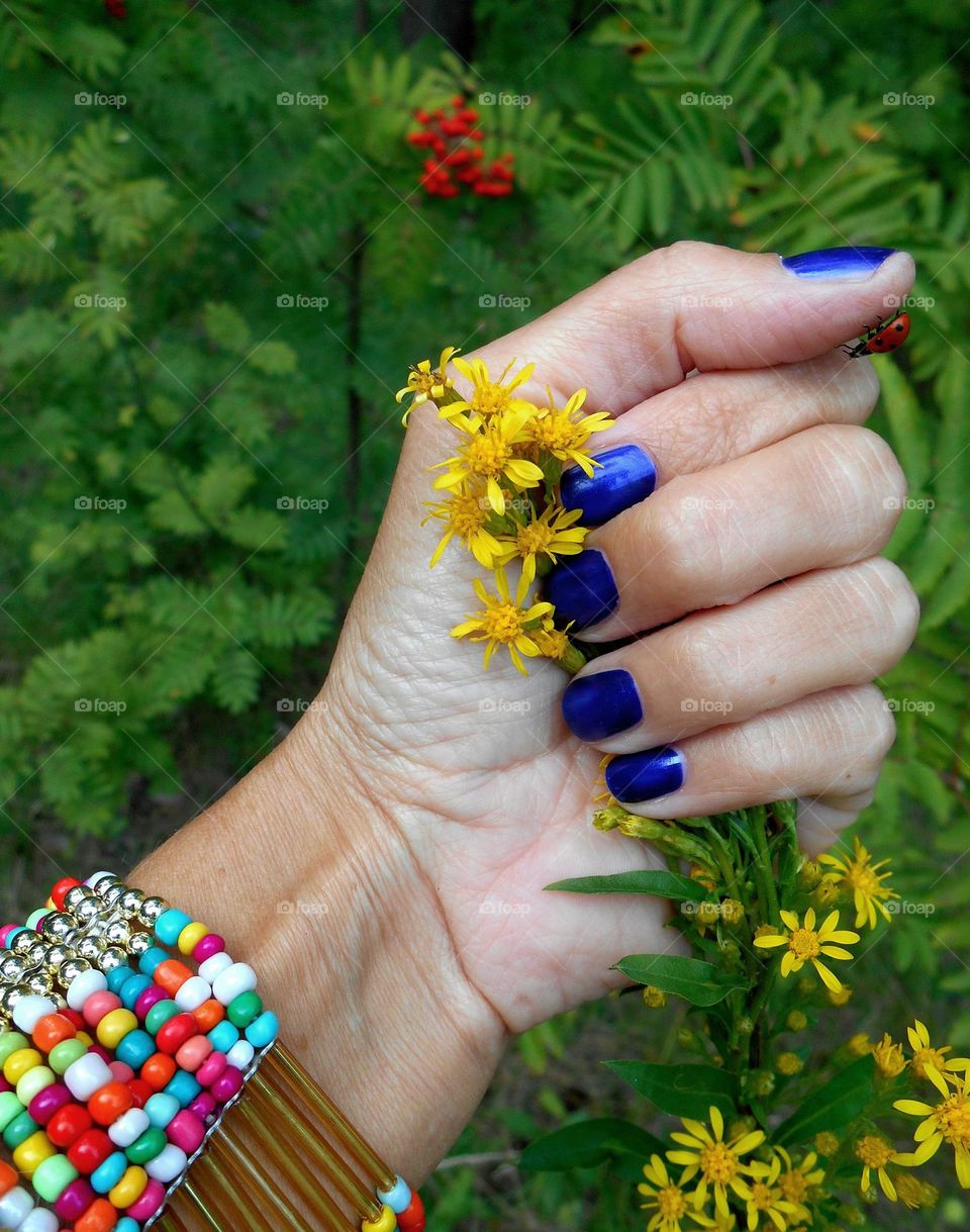 female hand with colour bracelet, beautiful accessories woman