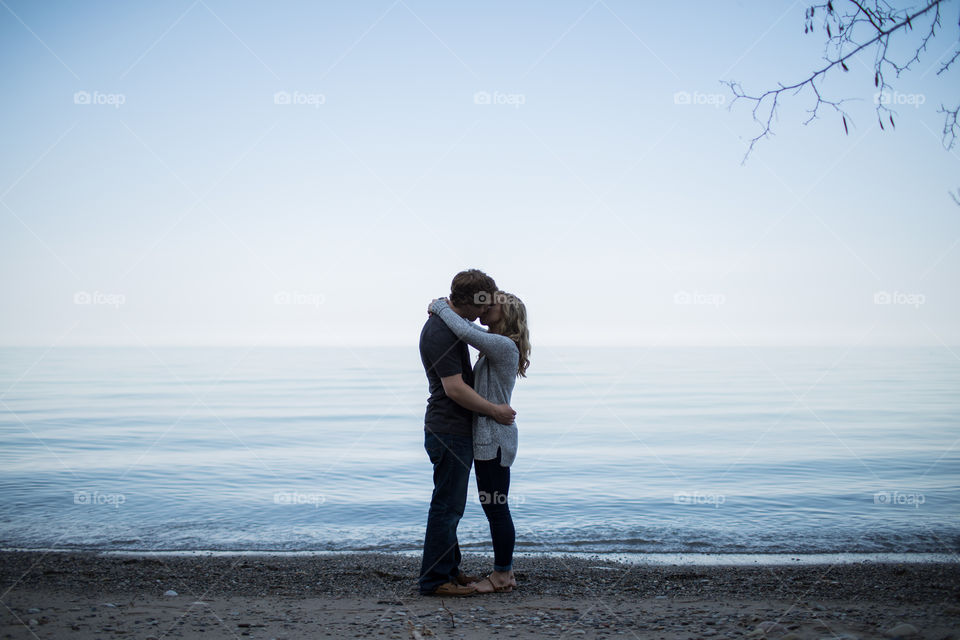 Couple Kissing By Lake