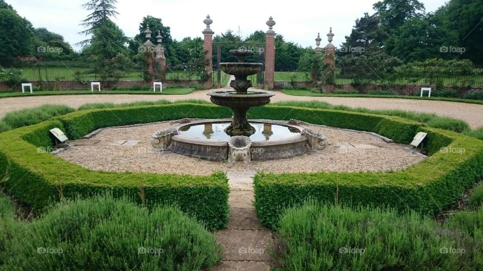 The grounds and fountain by the Georgian Manor House at Champneys Hotel and Spa in Henlow, Hertfordshire. Visited in Summer.