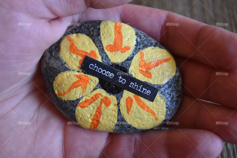 Rock painted with inspirational sentiment