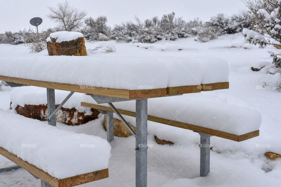 Snow on picnic table