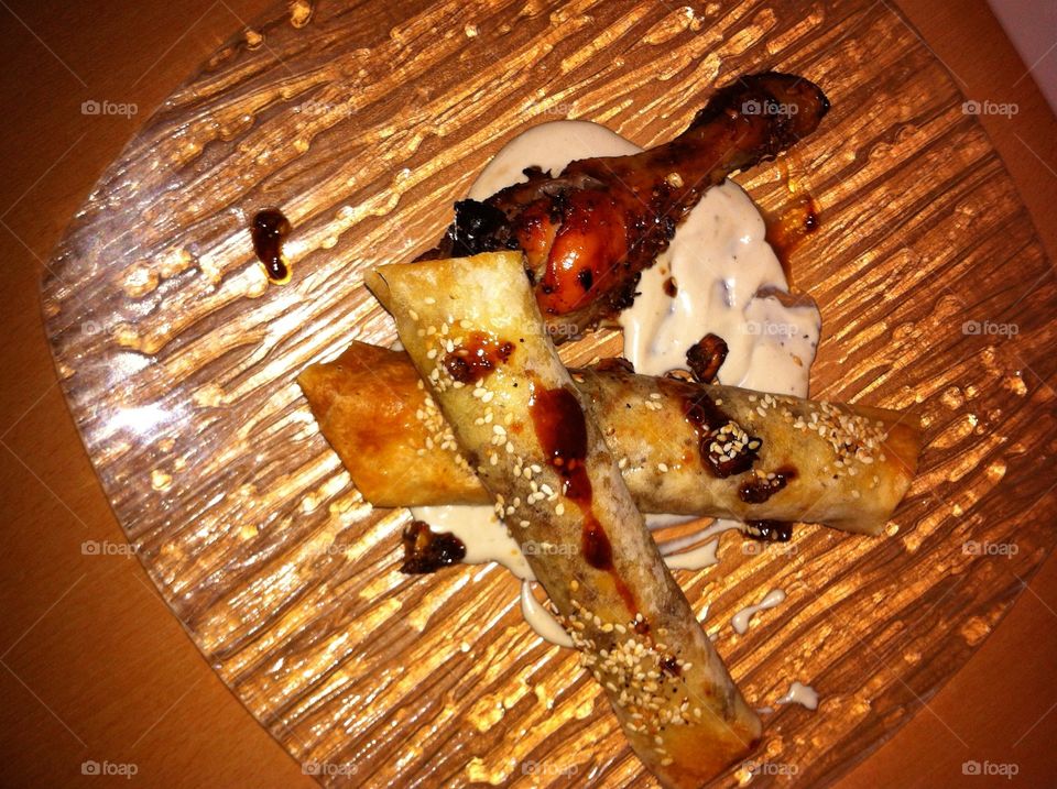 Chicken with dates and  cigars stuffed with meat raisins and tahini sauce