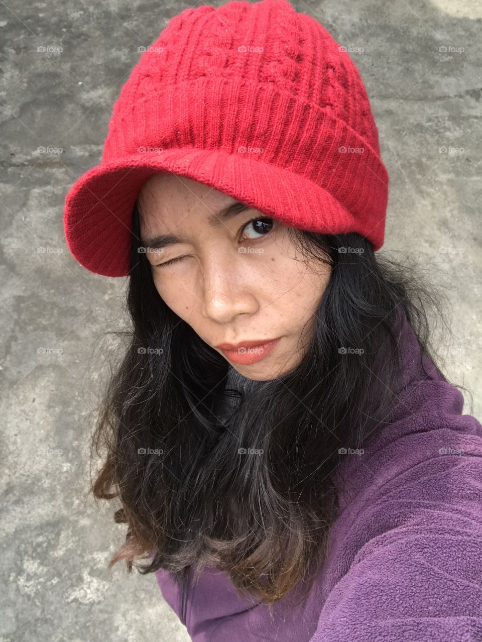 Red cap, black hair and red lip