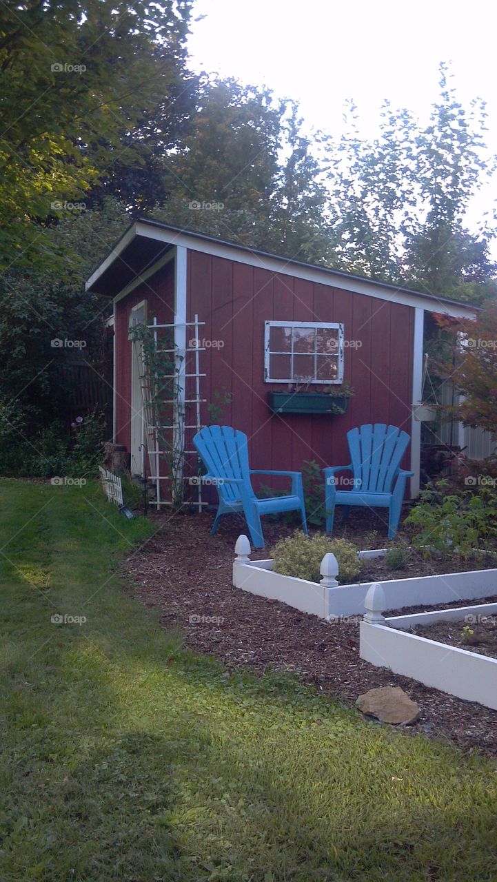 Garden Oasis. Garden with Adirondack chairs