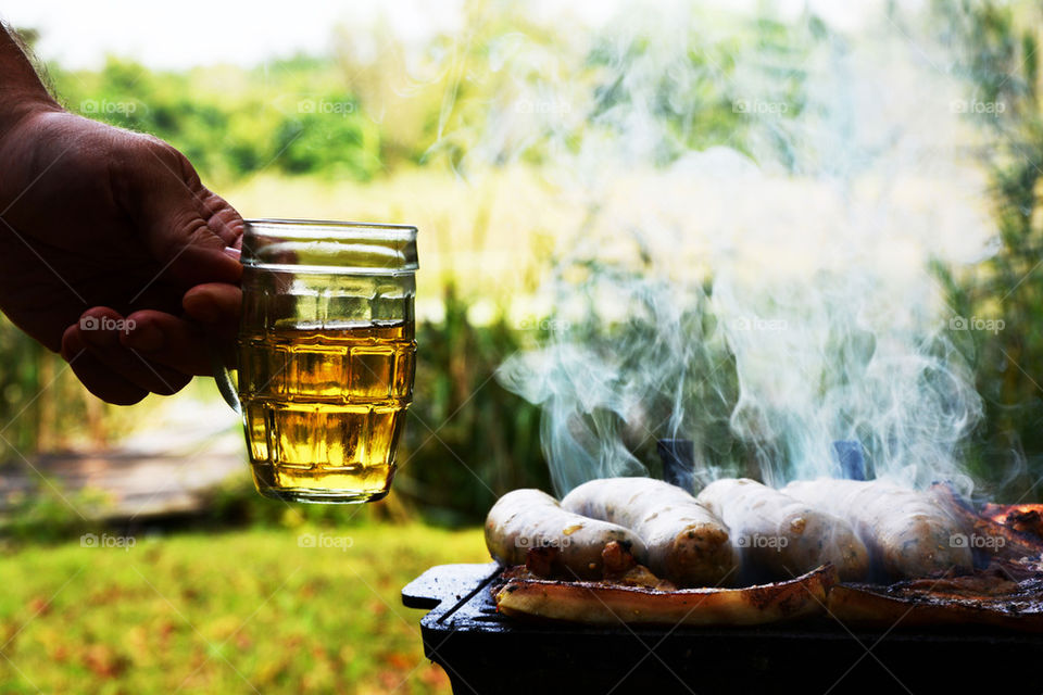 glass of beer and barbeque