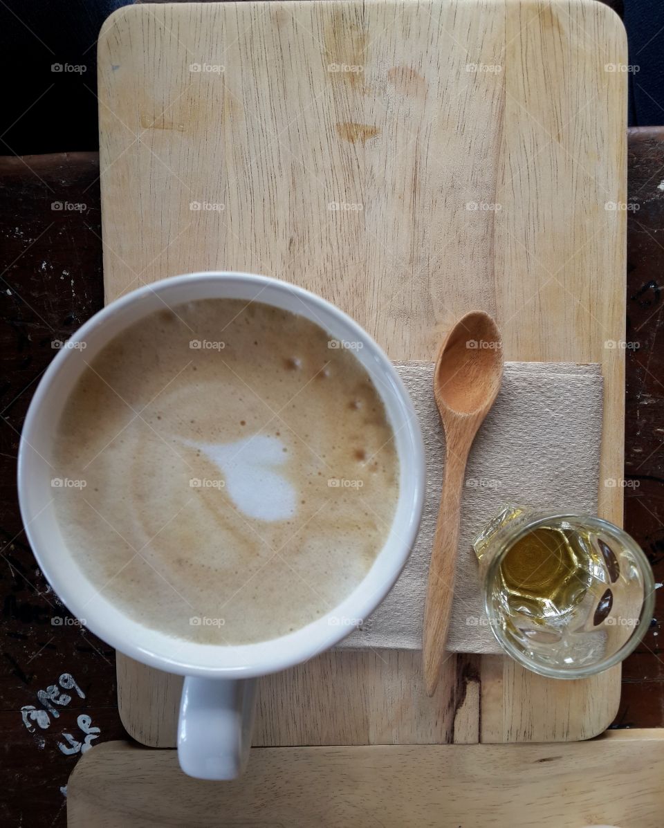 High angle view of coffee with heart shape