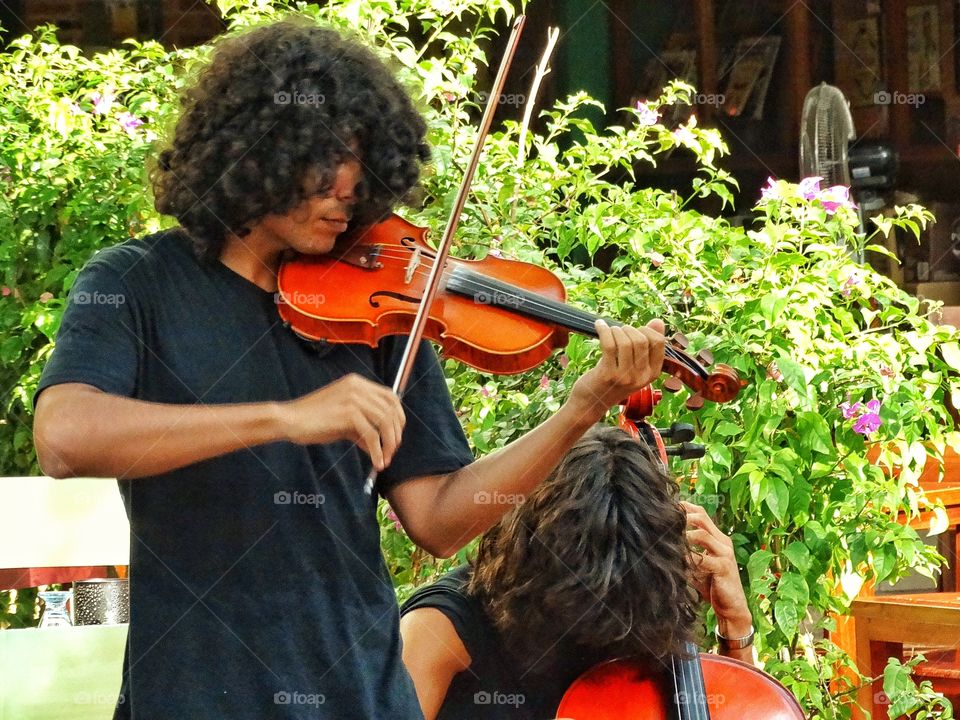 Street Musicians In Mexico. Mexican Street Musicians Playing Stringed Instruments In A 
Marketplace