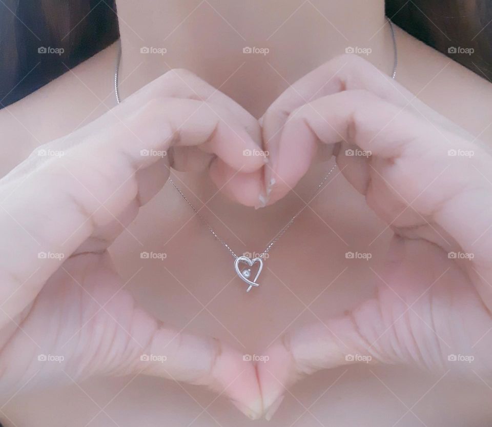 Beautiful pendant on woman with shape of heart